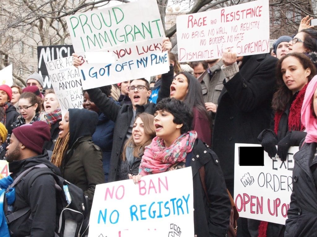 Boston rallies in Copley, Logan against Trump’s immigrant ban