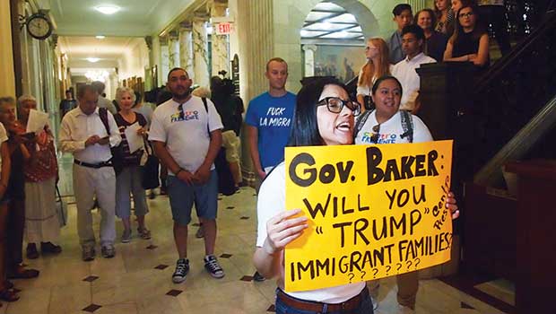 Activists press Gov. Baker on cooperation with U.S. Immigration