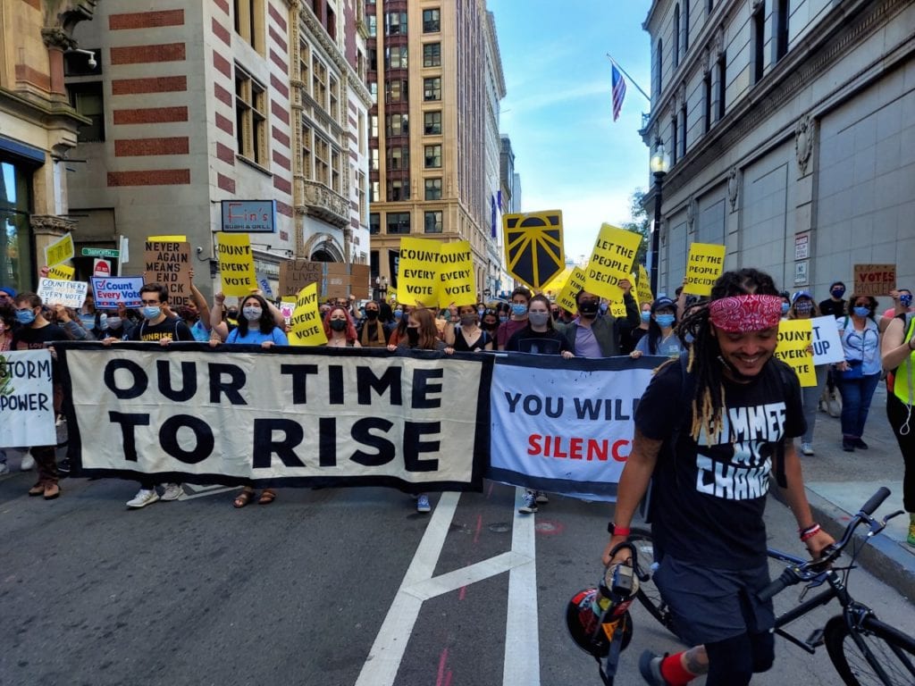 As Biden declared victor, demonstrators celebrate, call for continued action