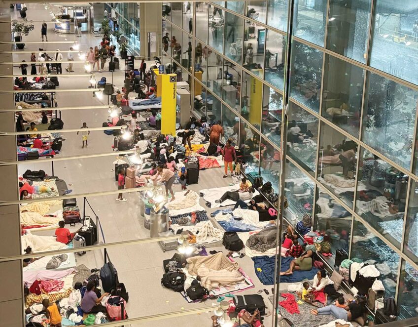 As summer travel heats up, migrant families still shelter at Logan Airport