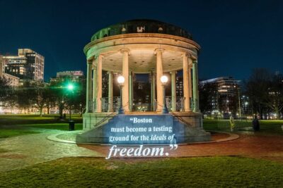 Guerrilla artist group projects anti-tyranny messages around Boston