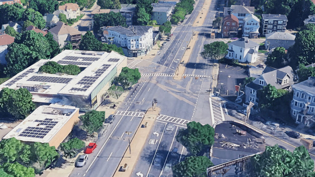 Before: A current view of the intersection of Blue Hill Avenue and Walk Hill Street on Google Earth. It is a somewhat desolate street with minimal green space, few sidewalks and concrete meridians.